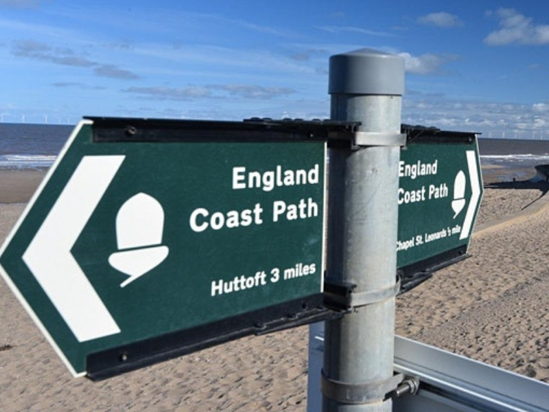 Lincolnshire coastal path sign and beach