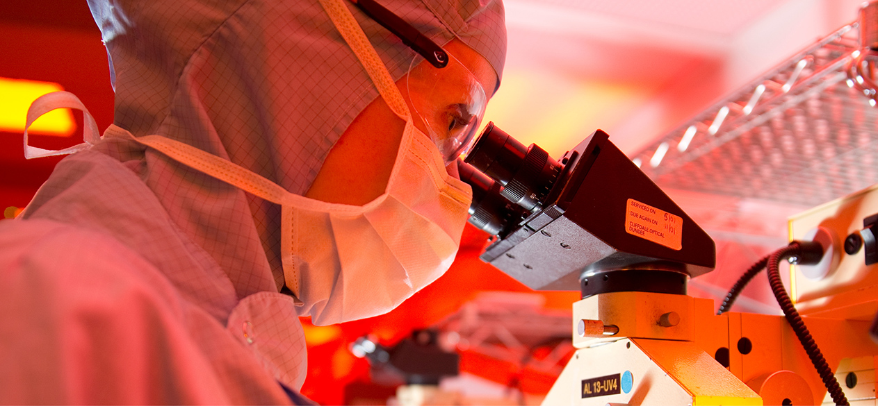 scientist with microscope